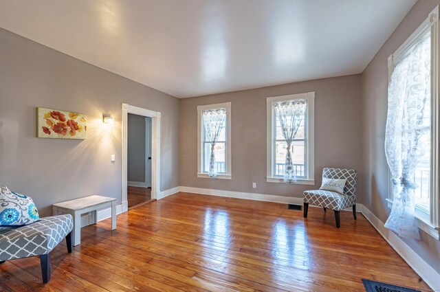 sitting room with hardwood / wood-style floors