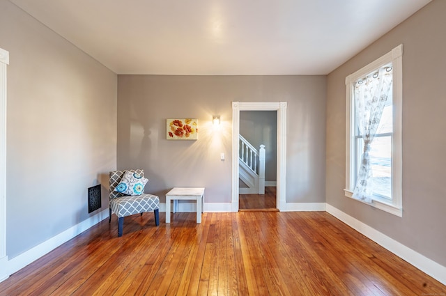 unfurnished room with hardwood / wood-style flooring