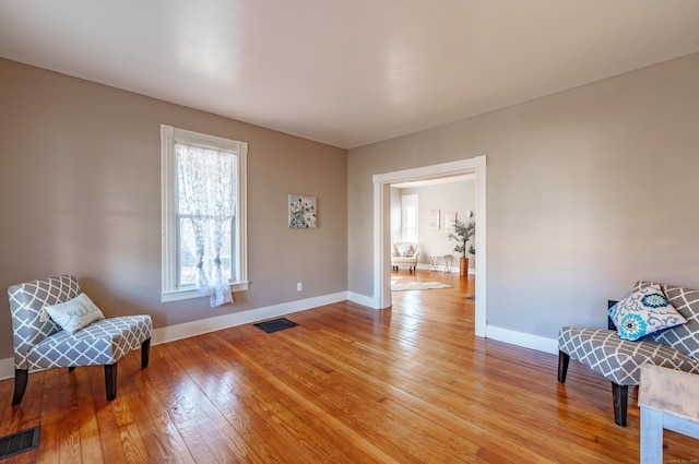 sitting room with light hardwood / wood-style flooring