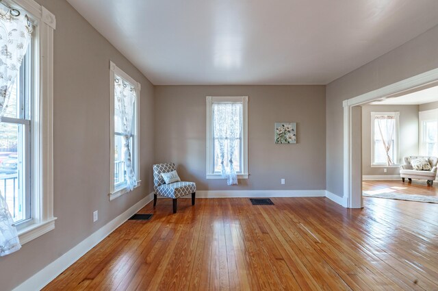 unfurnished room with light hardwood / wood-style flooring