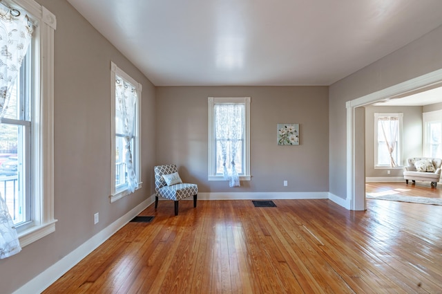 unfurnished room featuring light hardwood / wood-style floors