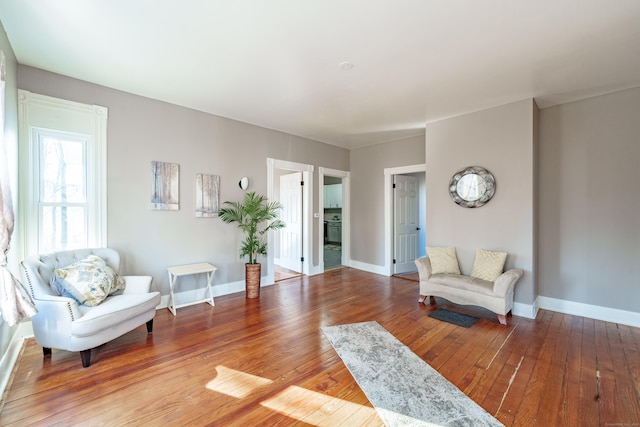 sitting room with hardwood / wood-style floors