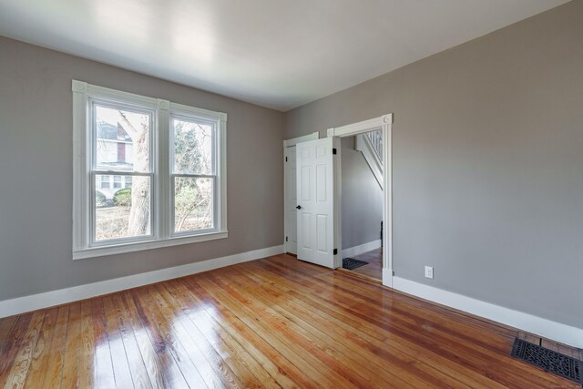 unfurnished bedroom featuring light wood-type flooring