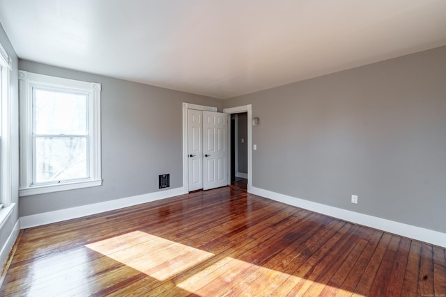 unfurnished room featuring wood-type flooring