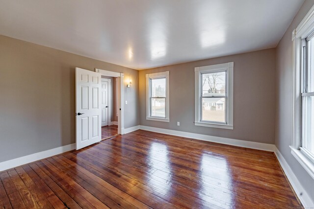 empty room featuring dark wood-type flooring