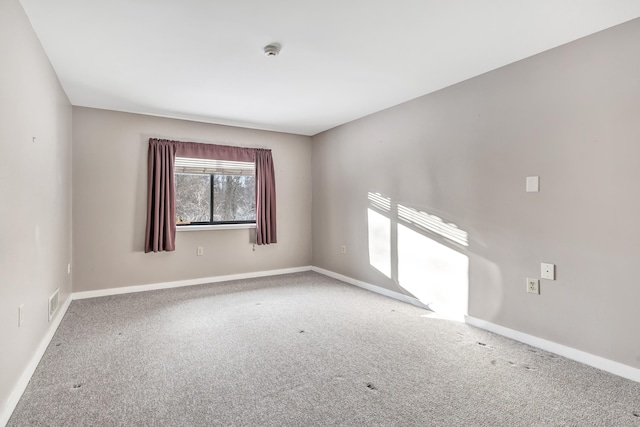 unfurnished room with carpet floors