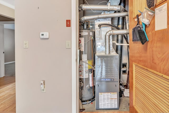 utility room featuring water heater