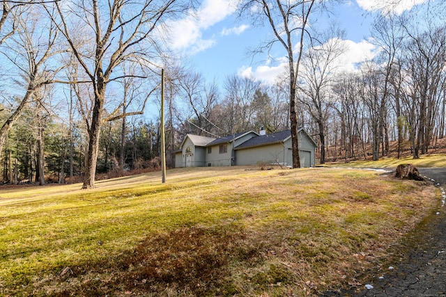 view of yard featuring a garage