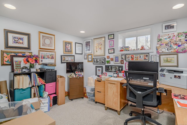 office area featuring light carpet