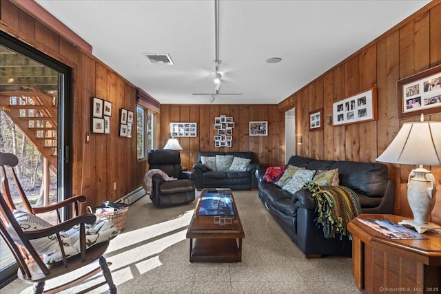 living room featuring ceiling fan, a baseboard radiator, and track lighting