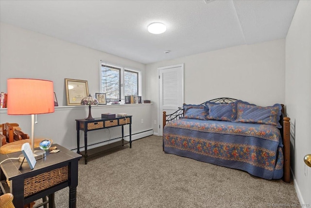 bedroom featuring a baseboard heating unit and carpet floors