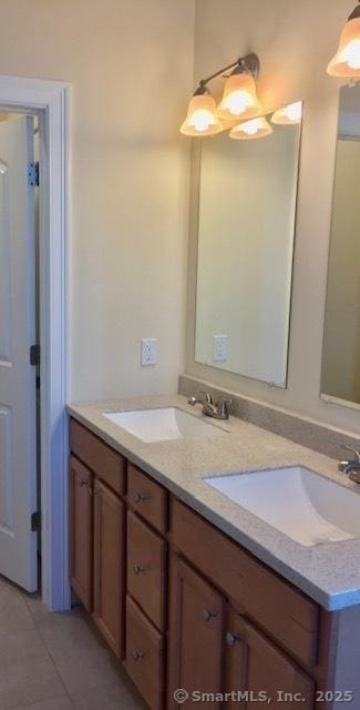 bathroom featuring tile patterned flooring and vanity