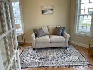 145 Webster Ln Unit 2-41, Middletown, CT 06457 - living area with baseboards and wood finished floors
