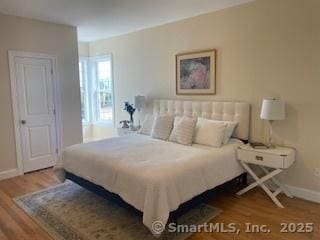 145 Webster Ln Unit 2-41, Middletown, CT 06457 - bedroom with baseboards and wood finished floors