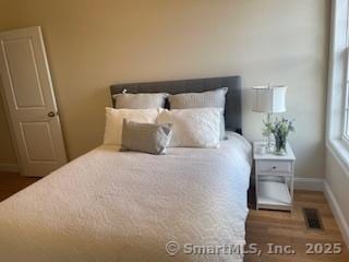 145 Webster Ln Unit 2-41, Middletown, CT 06457 - bedroom featuring baseboards and wood finished floors