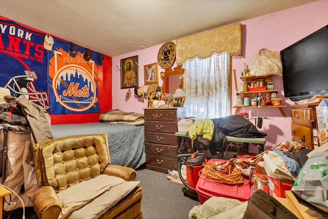 bedroom with carpet and a textured ceiling