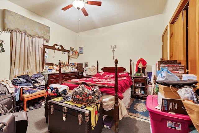 bedroom featuring ceiling fan and carpet