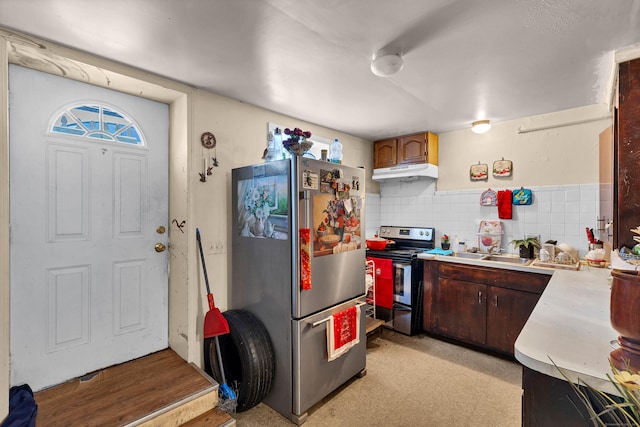 kitchen featuring sink, tasteful backsplash, dark brown cabinetry, and stainless steel appliances