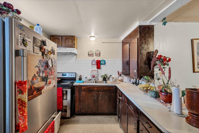 kitchen featuring sink, dark brown cabinetry, appliances with stainless steel finishes, and decorative backsplash