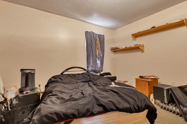 carpeted bedroom featuring a textured ceiling