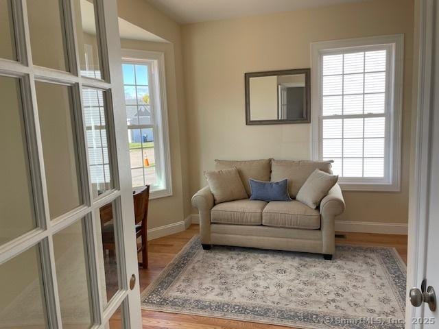 sitting room featuring wood-type flooring