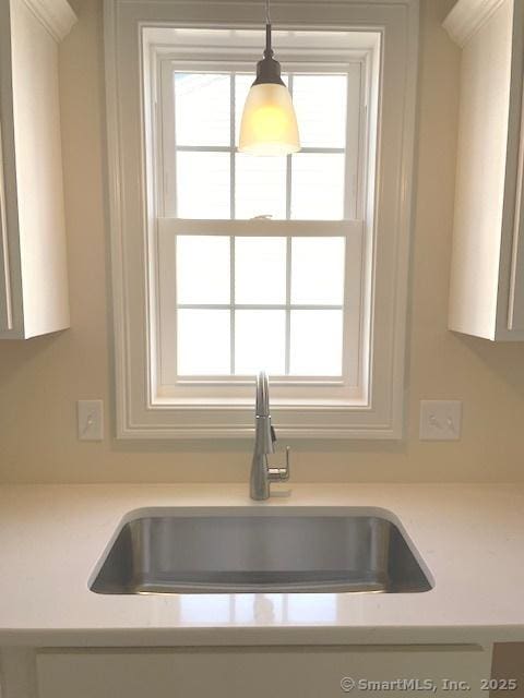 interior details with pendant lighting and sink