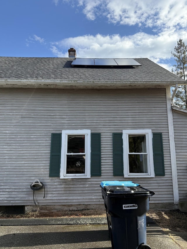 rear view of house with solar panels