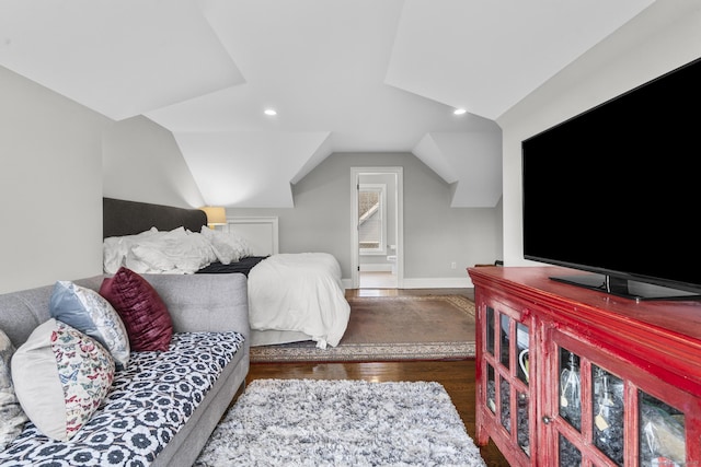 bedroom featuring vaulted ceiling and dark hardwood / wood-style flooring