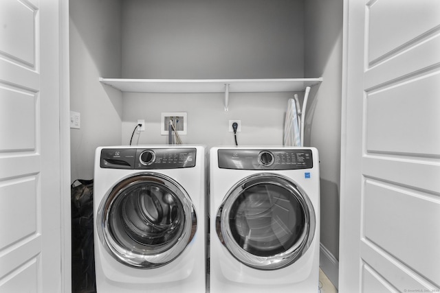 washroom featuring washing machine and dryer