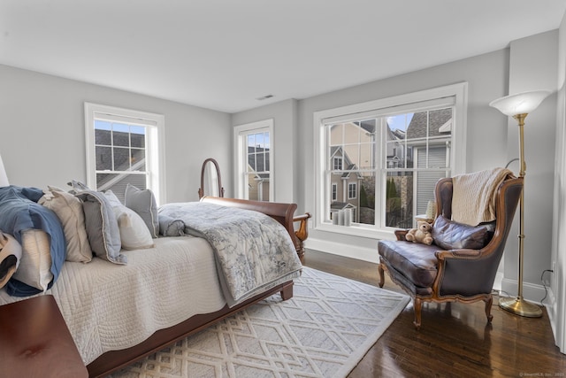 bedroom with hardwood / wood-style floors