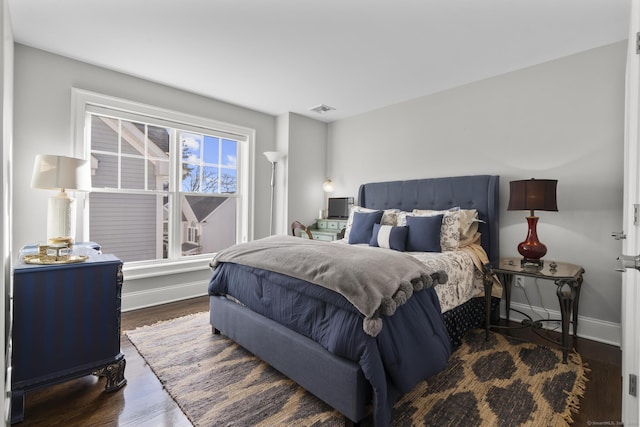 bedroom featuring dark wood-type flooring