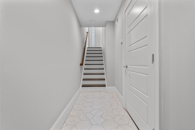 stairs featuring tile patterned flooring