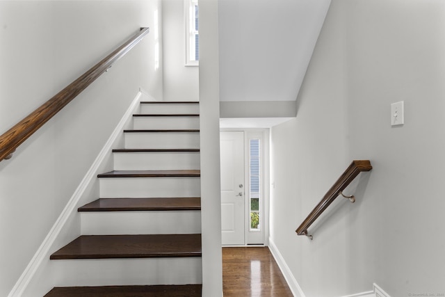 stairs with wood-type flooring