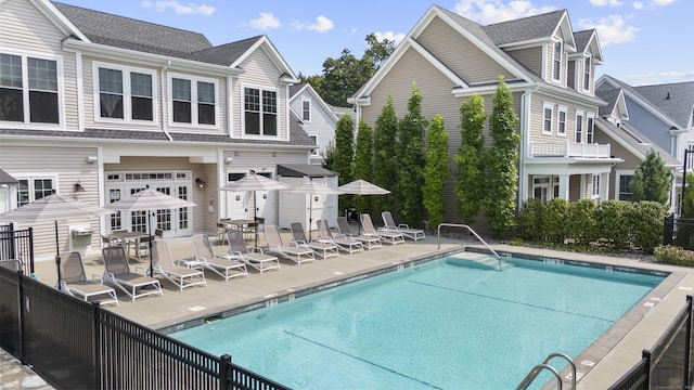 view of swimming pool with a patio