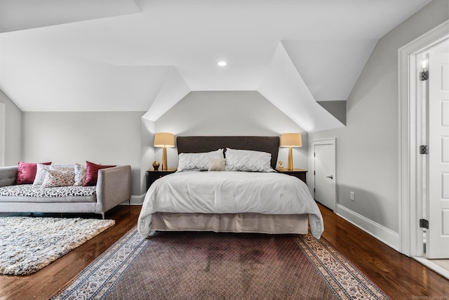 bedroom featuring dark wood-type flooring and lofted ceiling