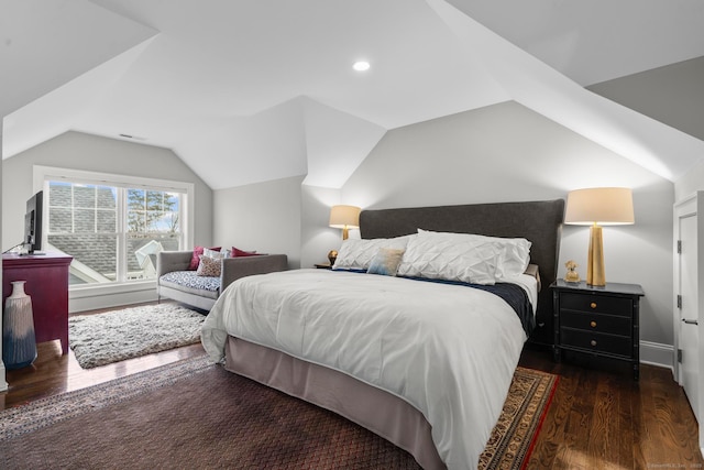 bedroom featuring lofted ceiling and dark wood-type flooring