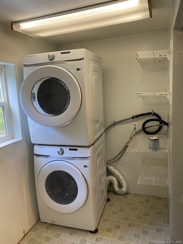 washroom with stacked washer / dryer