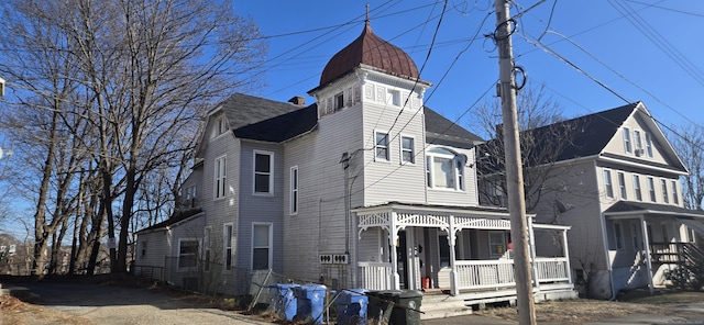 victorian house featuring a porch