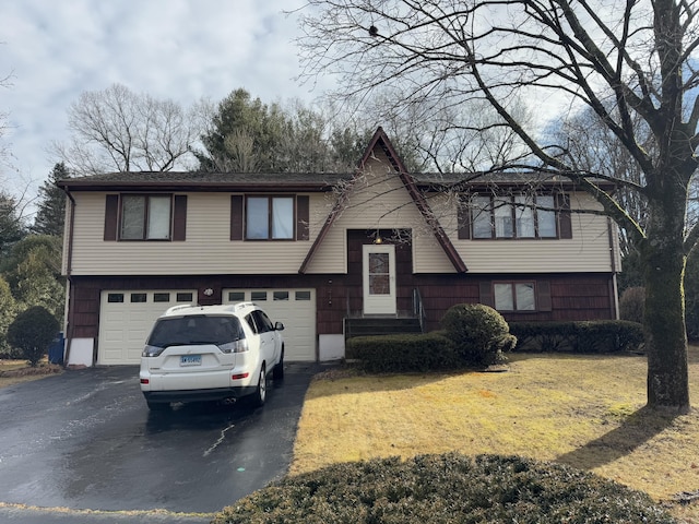 split foyer home featuring a garage