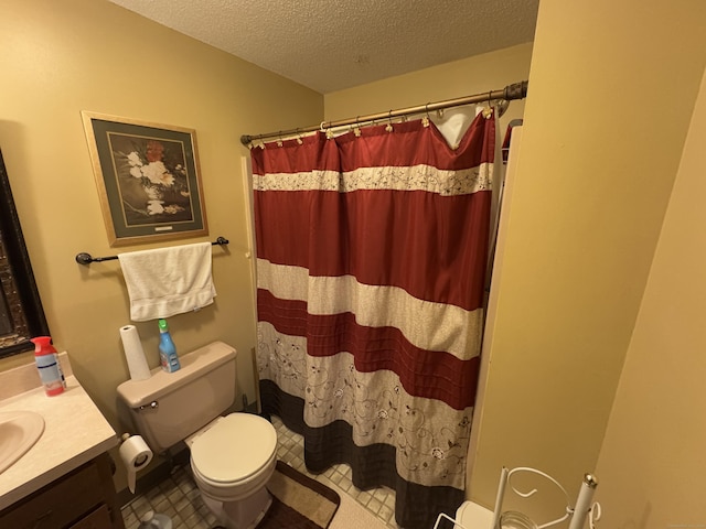 bathroom with toilet, a textured ceiling, vanity, and curtained shower