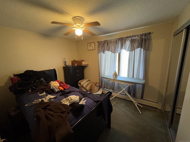 bedroom featuring ceiling fan, baseboard heating, dark carpet, and a textured ceiling