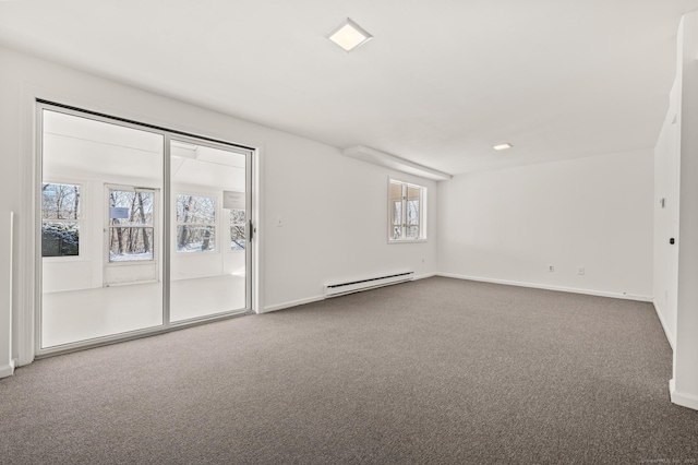 additional living space featuring baseboard heating and carpet flooring