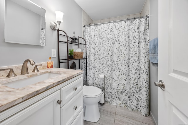 bathroom featuring toilet, vanity, and walk in shower