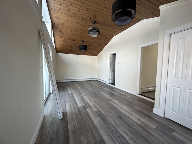 unfurnished room with dark hardwood / wood-style flooring, a baseboard heating unit, wood ceiling, and vaulted ceiling