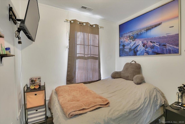 bedroom featuring ornamental molding