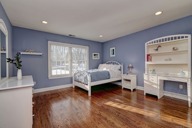 bedroom featuring dark hardwood / wood-style floors