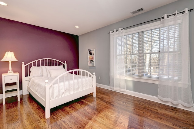 bedroom with hardwood / wood-style flooring