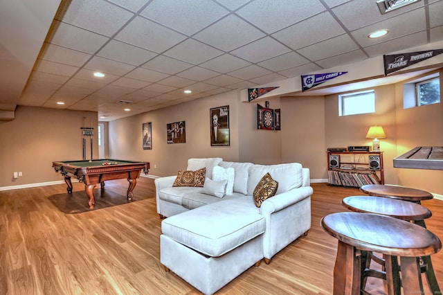 living room with a paneled ceiling, pool table, and light hardwood / wood-style flooring