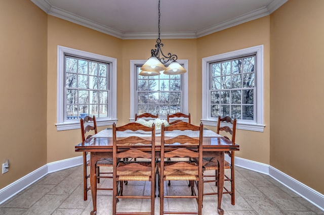 dining area featuring an inviting chandelier and ornamental molding