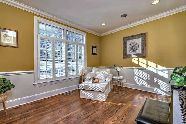 sitting room with ornamental molding and dark hardwood / wood-style floors